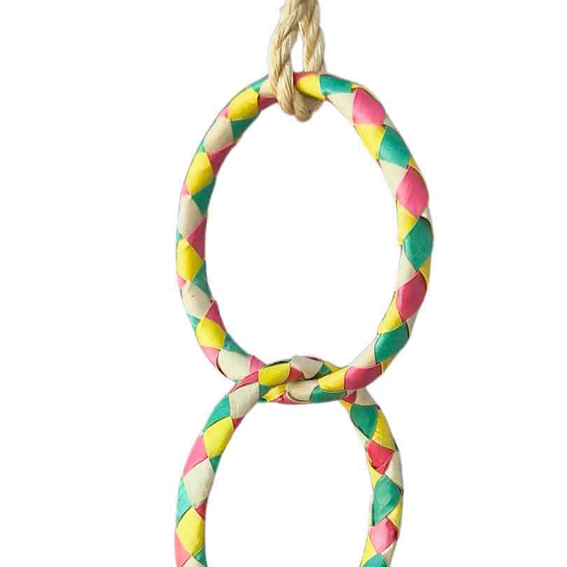 Close-up of the linked woven palm leaf rings on the Woven Wonders Four Rings bird swing