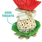 Close up of a Christmas Sola Cupcake showing its festive patty pan and paper ribbon