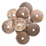 Close up of Coconut Shell Discs 10pk showing the natural coconut shell texture and pre drilled holes
