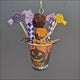 Halloween Parrot Treat Cup shown from different angles with colourful shreddable pieces
