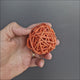 Colourful Wicker Ball Foot Toy showing the lightweight woven rattan design and open ball shape
