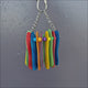Mini Popsicle Ring shown from different angles with colourful wooden sticks and beads